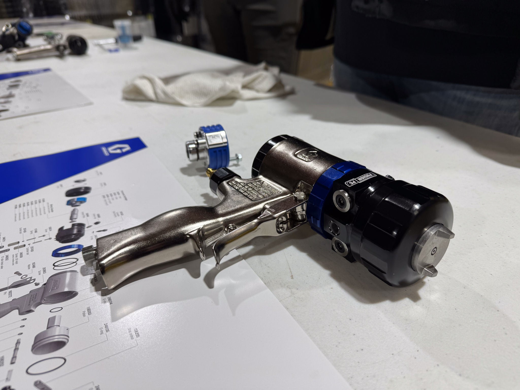 a close up image of a spray foam gun